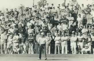 Lee Trevino and the gallery intently watch putt today on third hole during play at Canadian Open