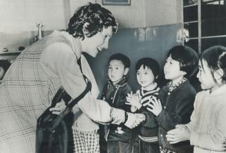 Margaret Trudeau met a group of children at the Pei Hai kindergarten in Peking during the seven-day tour of China she is making with her husband