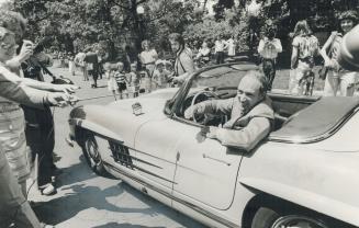 Pierre Trudeau pilots his Mercedes instead of the ship of state as he arrives for the transfer of power