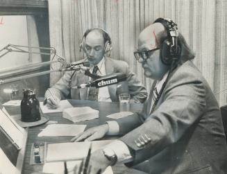 Prime Minister Pierre Trudeau makes notes of a caller's point of view as he takes part in an open line show on CHUM radio in Toronto today. Hosting th(...)