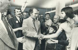 Hands are outstretched to greet Prime Minister Pierre Trudeau Saturday night in Thomas A