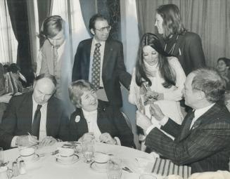 Friendly break. Ursula Apoloni, left, a Liberal contender in the Toronto area, doesn't seem to mind a bit yesterday at the Royal York Hotel as an attr(...)