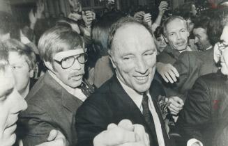 Crush of victory: Longing to see their leader, Liberals mobbed Pierre Trudeau last night after his victory speech at Ottawa's Chateau Laurier