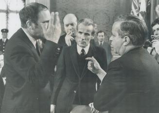 Prime Minister Pierre Trudeau, left, said Tuesday that Quebec Premier Jean Jacques Bertrand was off his rocker if he thought the federal government's (...)