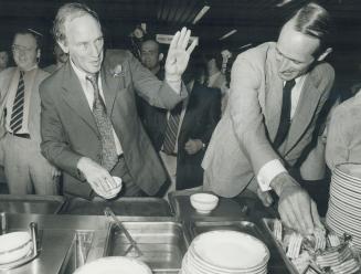 Prime Minister Pierre Trudeau and Liberal candidate John Evans load up at the Ryerson Polytechnical Institute cafeteria