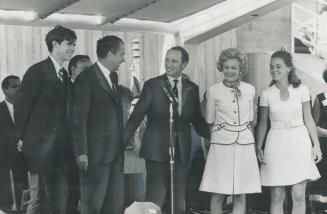 Flanked by famous names, Prime Minister Pierre Elliott Trudeau prepares to speak during ceremonies yesterday marking the 10th anniversary of the St. L(...)