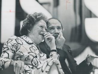Sharing a joke, Maryon Pearson, wife of former prime minister Lester Pearson, and Prime Minister Pierre Trudeau listen as Pearson makes reference to Trudeau's 53rd birthday today