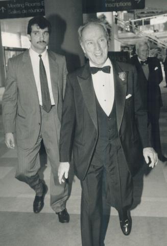Dinner guest: Former prime minister Pierre Elliot Trudeau, one of many dignitries from state and church who attended a dinner for Cardinal Carter, enters the convention centre last night