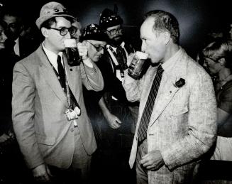 A more relaxed PM: While touring Western Ontario, Prime Minister said nice things about Brian Mulroney, was relaxed with Strathroy townspeople and, above, quaffed a stein at Kitchener's Oktoberfest