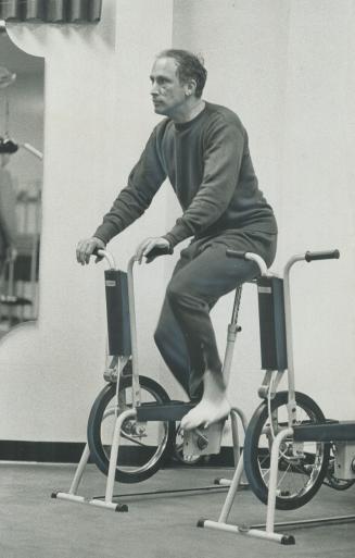 In case a campaign isn't exercise enough, Prime Minister Pierre Elliott Trudeau takes time out from campaigning for a workout in an Oshawa health club