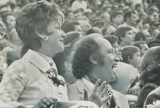 Fashion designer Cathy Carroll, a director of the Toronto Metros soccer club, and Prime Minister Pierre Trudeau watch Brazil defeat Bologna 2-1 in an exhibition game at Varsity Stadium last night