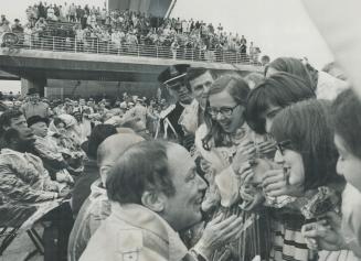 Mob of screaming girls surged around Prime Minister Pierre Elliott Trudeau yesterday, fighting to kiss him, touch him or get his autograph as he arriv(...)