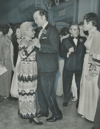Dancing with his hostess, at $50-a-plate Liberal Party fund-raising dinner last night in Toronto, Prime Minister Pierre Trudeau moves across floor wit(...)