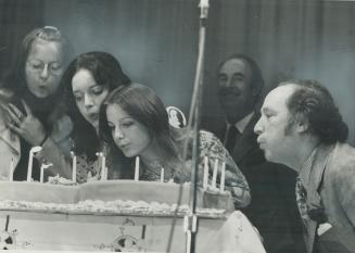 Prime minister Pierre Trudeau blows out the candles on a Canada cake presented to him yesterday by students at Royal York High School. Trudeau receive(...)