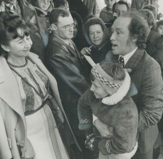 Behaving like a man on the campaign trail, Prime Minister Pierre Trudeau stooped down and hugged 8-year-old Bohdan Potichny of Winston Grove, Etobicok(...)