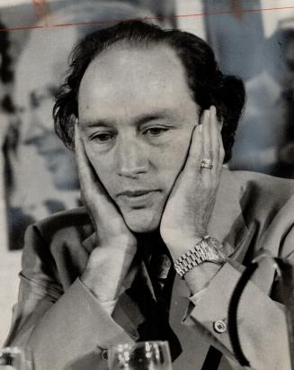 Prime Minister Pierre Trudeau cradles his head as he listens to discussion today with Ontario Liberal workers and candidates at Toronto's Airport Holiday Inn