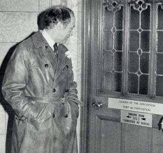 Liberal Leader Pierre Trudeau leaves his office after announcing his resignation as Leader of the Liberal Party