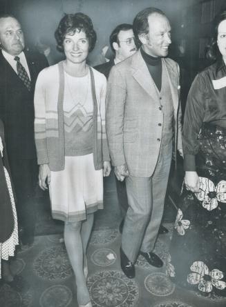 Prime Minister Pierre Trudeau and his wife, Margaret, both tanned from a holiday in Hawaii and Vancouver, arrive at the Liberal reception last night. (...)