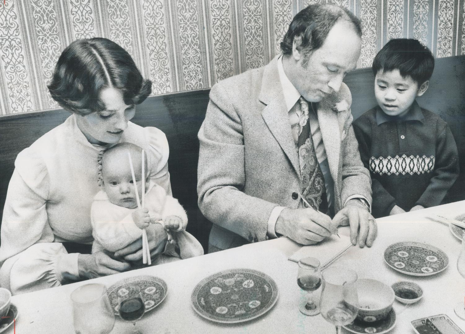 Even Sacha used chopsticks. Playing with chopsticks, 3-month-old Sacha Trudeau sits on his mother's lap in the Moon Wah restaurant on Dundas St. last (...)