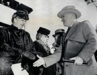 President Truman greets Mrs. Franklin D. Roosevelt at Brooklyn navy yard where he commissioned aircraft carrier named for the former president. Mrs. T(...)