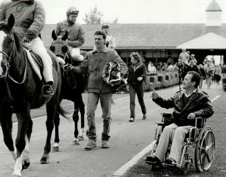 Parade to the post: Ron Turcotte, the great Canadian jockey who was paralyzed in a racing accident in 1978, dropped by Woodbine yesterday to watch the horses parade to the post