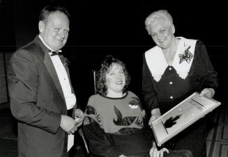 A valentine to remember. Barbara Turnbull is flanked by Rollie and Betty Fox, parents of the late Terry Fox, at last night's Great Valentine Gala, org(...)
