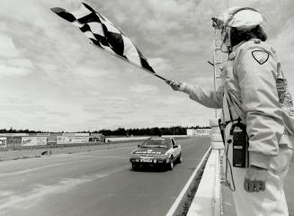 Fifteen minutes after the start of the regional sedan race, Anne Turner receives the checkered flag for a 16th place finish. Turner, who was a very re(...)