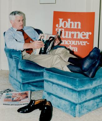Prime Minister John Turner relaxes in hotel room