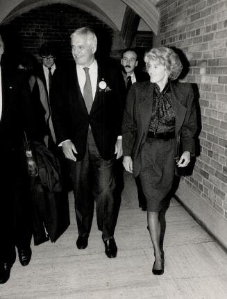 Parting smiles: Liberal leader John Turner and his wife Geills leave Hart House at the University of Toronto where he met yesterday with yount Liberals