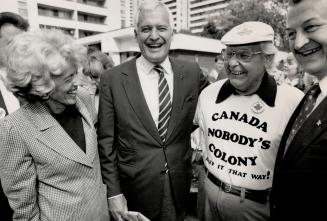 Like minds: Campaigning in the High Park area, Turner and wife Geills pause to chat with Charlie Paterson, 70, who wears his anti-free trade views on his chest