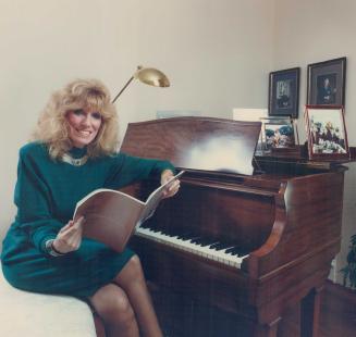 Top, Soprano Riki Turofsky sits by the Heintzman grand piano in the living room of her Kingsway home