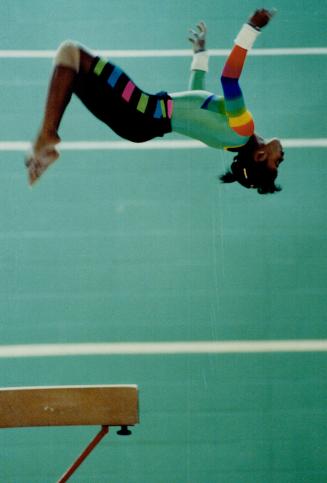 High-flying pair: At the age of 13, Stella Umeh, above, is one of the top-ranked gymnasts in Canada and has hopes of competing in the 1992 Olympics