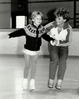 A helping hand: World figure skating champion Barbara Underhill, of the famed Martini and Underhill duo, takes time out to lend a hand to Oshawa Skating Club student Lara McQuay, 7