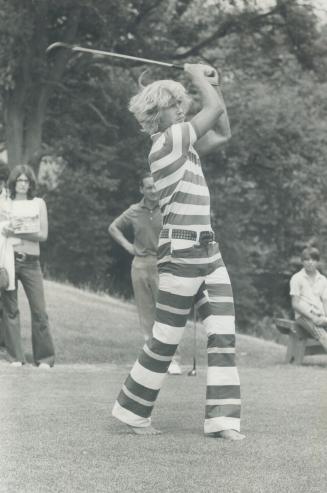 Shoeless splendor: St. Louis Blues' Garry Unger, his long hair bleached by Florida sun, golfs in gaudy attire of purple, white and gold but shuns any footwear