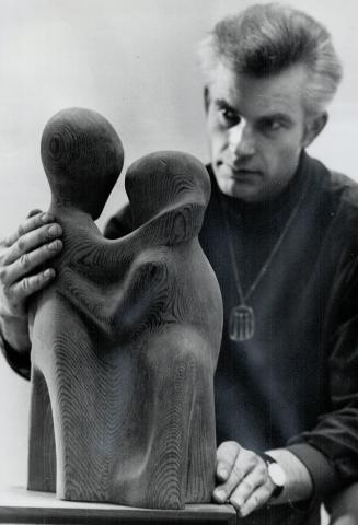 Gerd Unterman with carving. The artist uses British Columbia cedar for his sculpture