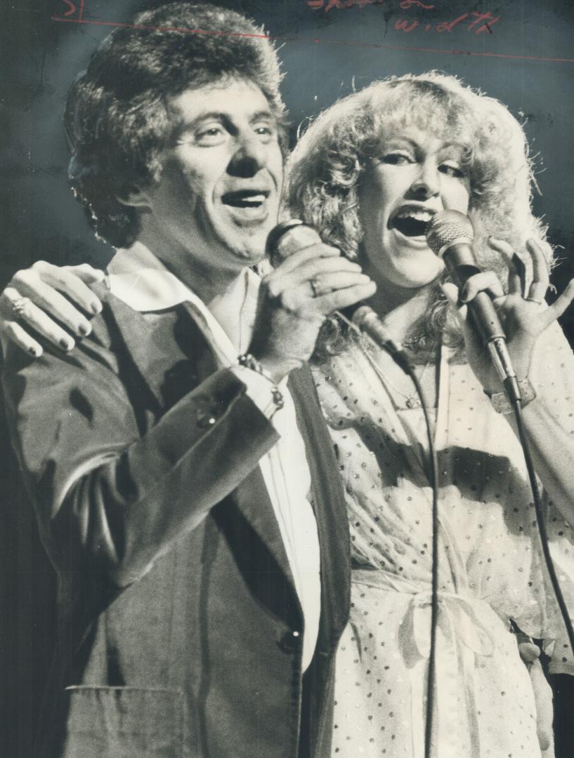 Frankie Valli sings briefly with backup singer Kim O'Kelly in show at the Grandstand last night