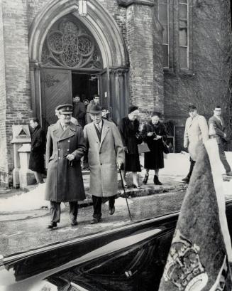 Vaniers Leave St. Basil's Church. Governor-General Vanier and Mme. Vanier leave St. Basil's Church, Bay, St., after Lent noon mass, with aide, left, C(...)