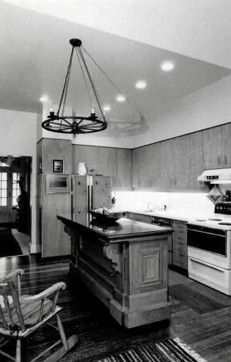 Thoughtful planning: Above, original wood floors warm the kitchen which once was a library