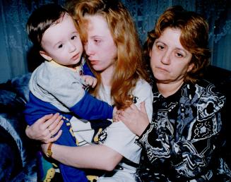Slain man's family. Rebecca Vega, holding son Tony Jr., grieves last night with mother-in-law Betty Vega for husband Luis Antonio Vega, 28, inset. Veg(...)