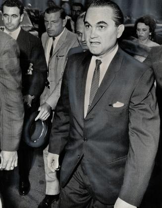 The cause. Alabama's pro-segregationist Governor George Wallace arrives at the Royal York last night. He will speak to Lions tion at Maple Leaf Gardens today
