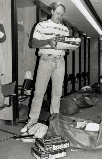 Packing up: Relief pitcher Duane Ward cleans out his locker at the Blue Jays' SkyDome clubhouse yesterday, one day after the season came to a screeching halt