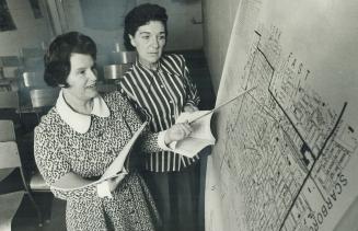 Inez Wardle, seeking to succeed her husband, Tom, as alderman in Ward 9, looks over a map of the ward with Elizabeth Andrews (right), who's helping he(...)