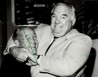 A headlock for charity. Whipper Billy Watson has Maple Leafs vice-president King Clancy in his grip to promote the Three Star Challenge, launched yest(...)