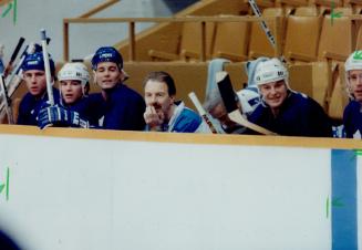 Leaf head coach Tom Watt took an unfamiliar turn as the man in the middle on the bench during yesterday's upbeat practice at Maple Leaf Gardens
