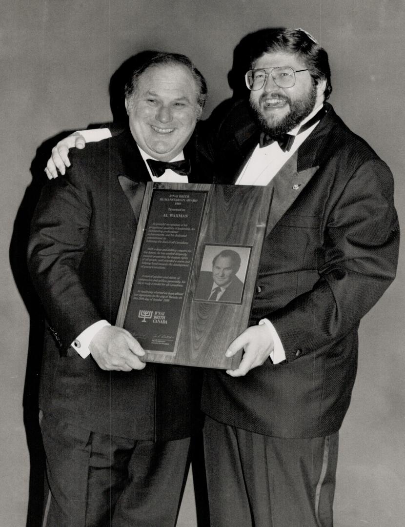 Class act: Television actor Al Waxman, left, is congratulated by Moishe Smith, Canadian President of B'nai Brith, for his unflagging contributions to charities