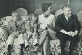 Thomas Wells, Ontario's new Health Minister relaxes with his family at Queen's Park shortly after Premier John Robarts announced his appointement. He'(...)