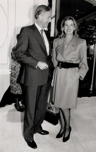 Left, Hilary Weston, in a red Yves Saint Laurent dress, with husband Galen