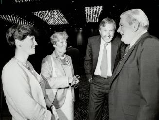 From the U.S.: Galen Weston (second from right) talked with a Richmond, Va., family, after shareholders quizzed him yesterday. Douglas and Dorothy McM(...)