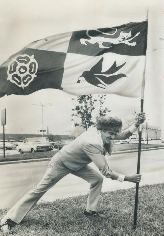 Wearing Coonskin hat, York Mayor Philip White invades North York today to plant his borough's flag and lay claim to Yorkdale Shopping Plaza-part of neighboring North York