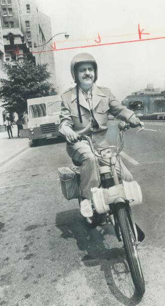 The Mayor on the moped. On his way to a meeting at Toronto City Hall, York Mayor Philip White rode down University Ave. yesterday on his new, gasoline(...)